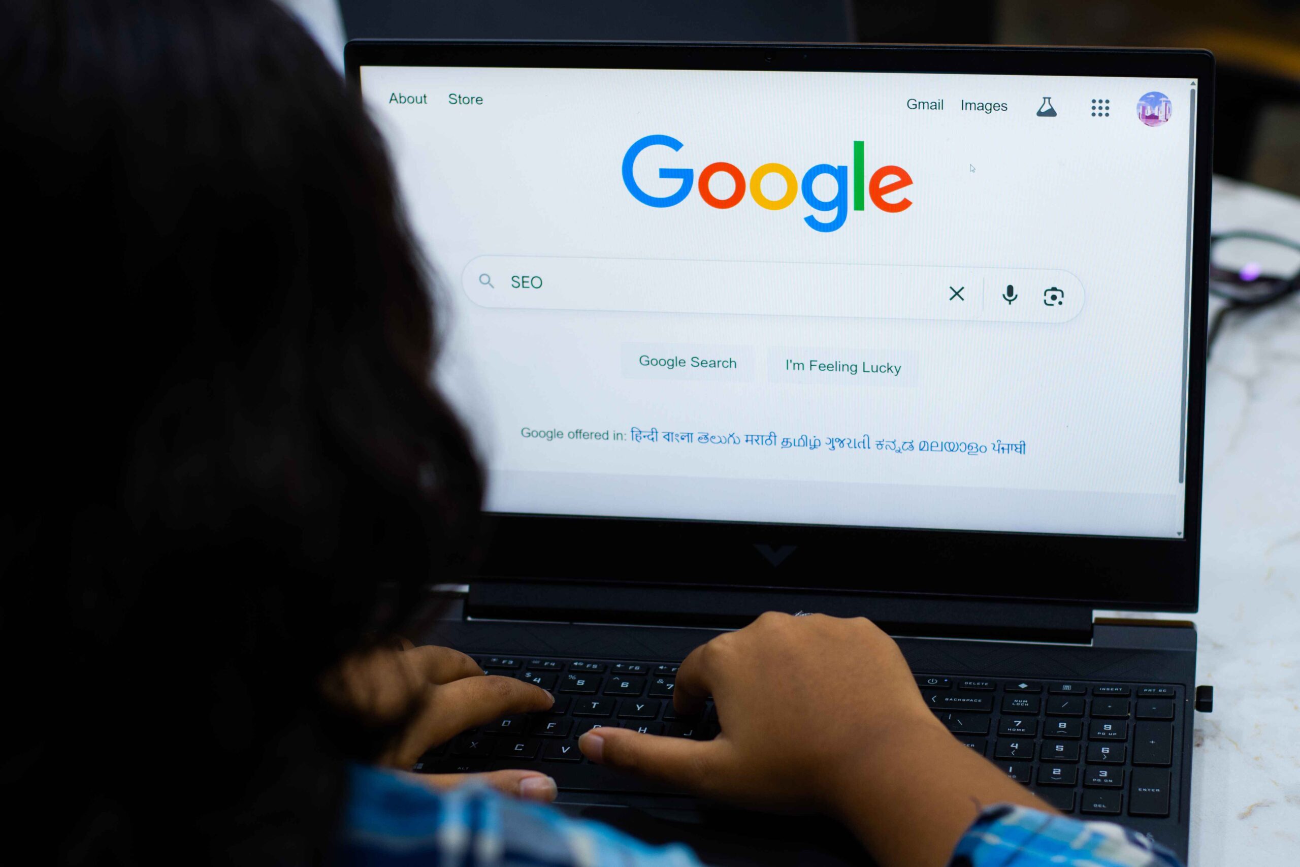 Student researching SEO on Google during training session.